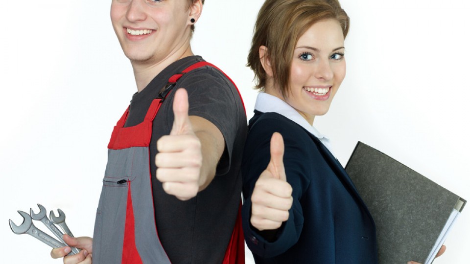 Apprentices for car mechanic and office having thumbs up